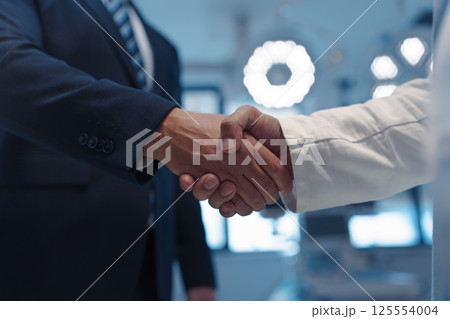 Hospital business handshake in medical environment Hospital business handshake in medical environment 125554004