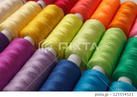 Set of colorful spools of thread 125554521
