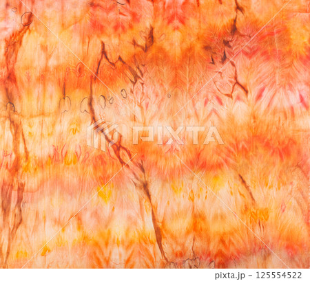 abstract pattern on silk fabric texture in yellow and brown tones 125554522
