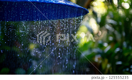 close-up of a blue umbrella with water droplets...のイラスト素材 [125555235 ...