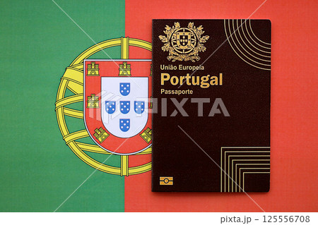 Red Portugal passport of European Union on national flag background close up 125556708