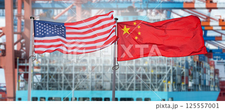American and Chinese flags on the background of ship with containers. Symbol of trade war. 125557001