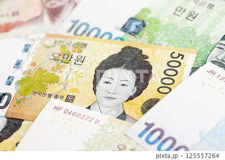 South Korean won money bills in big amount lies on white color table close up 125557264
