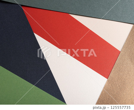 Paper background with matte texture. Layered geometric triangles in crimson red, pastel green, Paper background with matte texture. Layered geometric triangles in crimson red, pastel green, 125557735
