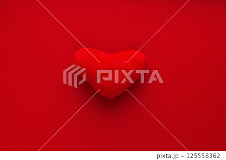 Red Love Heart Shaped Plush On Bright Monochromatic Background Red Love Heart Shaped Plush On Bright Monochromatic Background 125558362
