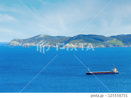 Ferryboat  and Atlantic coastline. 125558731