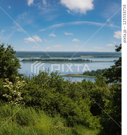 Dnipro river blossoming shores summer landscape, Kaniv water Reservoir, Kyiv Region, Ukraine. Dnipro river blossoming shores summer landscape, Kaniv water Reservoir, Kyiv Region, Ukraine. 125558758