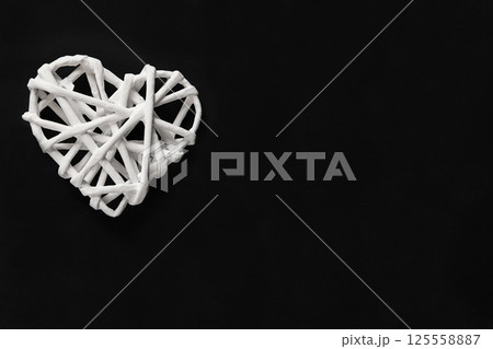 Elegant White Blossoms on Spa Stones with Minimalist Black Background 125558887