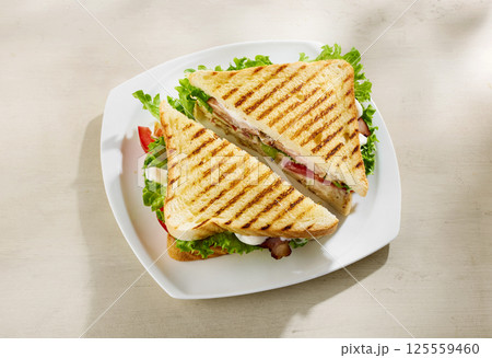 club sandwich on white plate 125559460