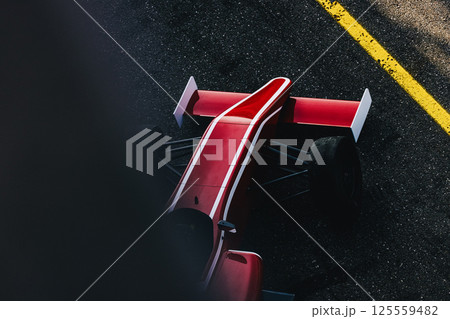 Formula race car in box, red sports car, circuit track, top view 125559482