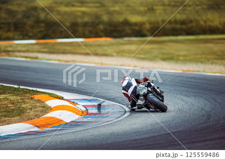 Motorcycle race, rear view. Speed, circuit racing. Motorbike sport Motorcycle race, rear view. Speed, circuit racing. Motorbike sport 125559486