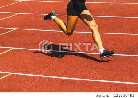 Run, track and fied banner with copy space. Running womans legs Run, track and fied banner with copy space. Running womans legs 125559493