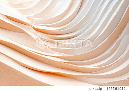Beautiful sunset over wind sculpted sand dunes showcasing warm tones and intricate patterns 125561912