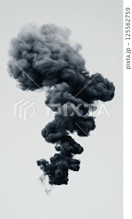 Black smoke billowing into a once clear sky, rising from a fire and creating a toxic cloud that dramatically illustrates the dangers of pollution and environmental degradation 125562759