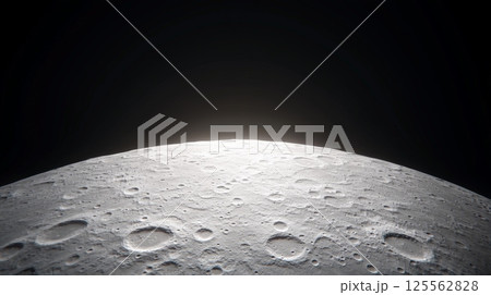 Sunlight illuminating the lunar horizon reveals detailed close ups of the moon's surface and craters, creating a striking contrast against the dark expanse of space 125562828