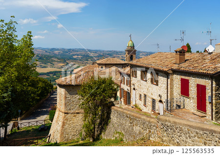 Scenic italian countryside village with historic stone buildings and rolling hills in Verucchio, Italy Scenic italian countryside village with historic stone buildings and rolling hills in Verucchio, Italy 125563535