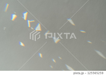 Crystal light reflections for overlay mockup on light background. Abstract prism reflection, rays leaking through lens effect. Rainbow holographic shadow mock up, iridescent wallpaper Crystal light reflections for overlay mockup on light background. Abstract prism reflection, rays leaking through lens effect. Rainbow holographic shadow mock up, iridescent wallpaper 125565259