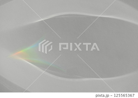 Caustic effect light refraction on white wall overlay photo mockup, blurred sun rays refracting through glass prism with shadow. Abstract natural light refraction silhouette on water surface Caustic effect light refraction on white wall overlay photo mockup, blurred sun rays refracting through glass prism with shadow. Abstract natural light refraction silhouette on water surface 125565367