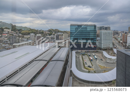 March 24 2025 March 24 2025 March 24 2025 Landscape with Buildings and Rolling Hills, Japan 125568073
