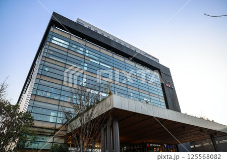 March 24 2025 Modern Office Building With Glass Facade at Dusk, Japan 125568082