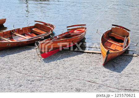 several wooden boats on the shore 125570621