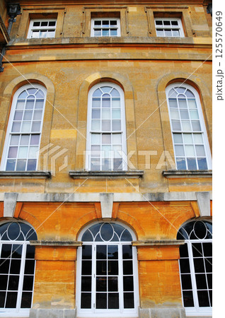 windows on yellow brick walls 125570649