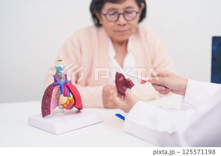 Doctor with Respiratory system. Elderly Patient consultation medical health for Lung Cancer, Asthma, Chronic Obstructive Pulmonary, Bronchitis, Emphysema, Cystic Fibrosis, Bronchiectasis, Pneumonia Doctor with Respiratory system. Elderly Patient consultation medical health for Lung Cancer, Asthma, Chronic Obstructive Pulmonary, Bronchitis, Emphysema, Cystic Fibrosis, Bronchiectasis, Pneumonia 125571198