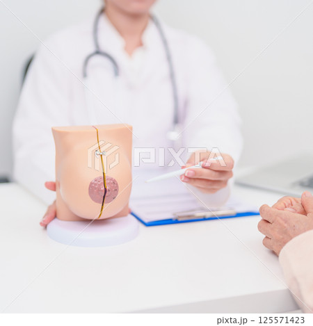 woman Patient consultation with doctor for Breast Augmentation Surgery, October Breast Cancer Awareness month, implant, Diagnosis, Beauty woman enlargement and medical healthcare concept 125571423