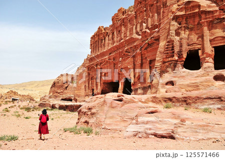 A woman travels at Petra site in Jordan. A woman travels at Petra site in Jordan. 125571466