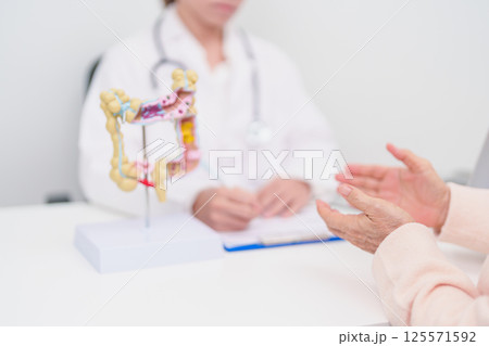 Elderly woman Patient consultation with doctor for Colon disease, Large Intestine, Colorectal cancer, Ulcerative colitis, Diverticulitis, Irritable bowel syndrome, Digestive system and Healthcare 125571592