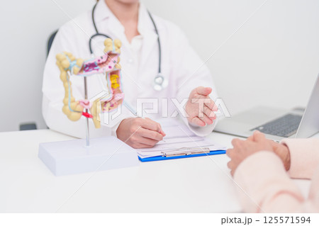 Elderly woman Patient consultation with doctor for Colon disease, Large Intestine, Colorectal cancer, Ulcerative colitis, Diverticulitis, Irritable bowel syndrome, Digestive system and Healthcare 125571594