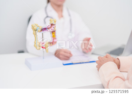 Elderly woman Patient consultation with doctor for Colon disease, Large Intestine, Colorectal cancer, Ulcerative colitis, Diverticulitis, Irritable bowel syndrome, Digestive system and Healthcare 125571595