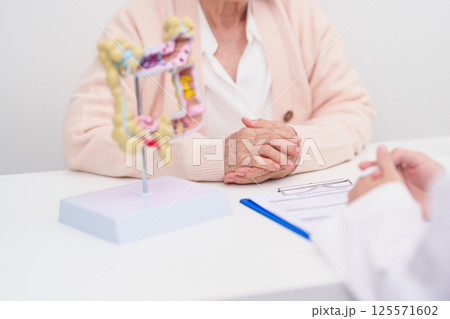 Elderly woman Patient consultation with doctor for Colon disease, Large Intestine, Colorectal cancer, Ulcerative colitis, Diverticulitis, Irritable bowel syndrome, Digestive system and Healthcare Elderly woman Patient consultation with doctor for Colon disease, Large Intestine, Colorectal cancer, Ulcerative colitis, Diverticulitis, Irritable bowel syndrome, Digestive system and Healthcare 125571602