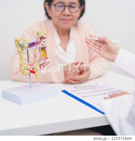 Elderly woman Patient consultation with doctor for Colon disease, Large Intestine, Colorectal cancer, Ulcerative colitis, Diverticulitis, Irritable bowel syndrome, Digestive system and Healthcare 125571604