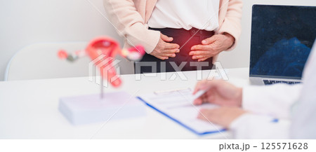 Elderly Woman patient consulting doctor with anatomy Uterus and Ovaries. Ovarian and Cervical cancer, Cervix disorder, Endometriosis, Hysterectomy, Uterine fibroids, Reproductive system and Pregnancy 125571628
