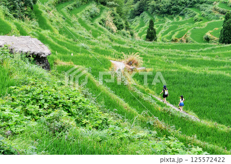 two young ladys standing on the terraces two young ladys standing on the terraces 125572422
