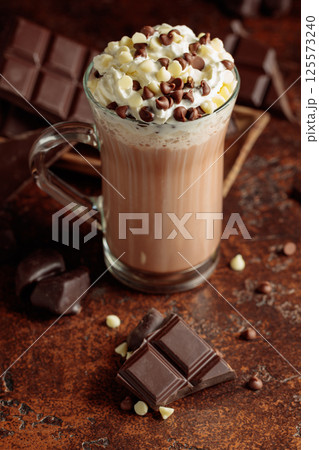 Hot chocolate cocoa drink with whipped cream. 125573240