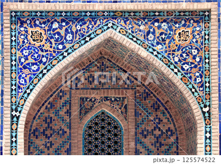 Famous landmark - Ulugh Beg Madrasah on Registan square, Samarkand, Uzbekistan. Arch with tile ornament in the courtyard of Ulugh Beg Madrasa, Registan, Samarkand Famous landmark - Ulugh Beg Madrasah on Registan square, Samarkand, Uzbekistan. Arch with tile ornament in the courtyard of Ulugh Beg Madrasa, Registan, Samarkand 125574522