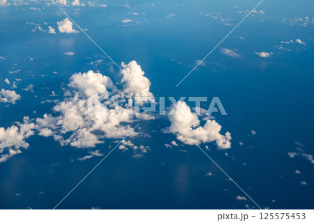 Aerial cloudscaspe picturesque clouds and sky from top view over the horizon 125575453