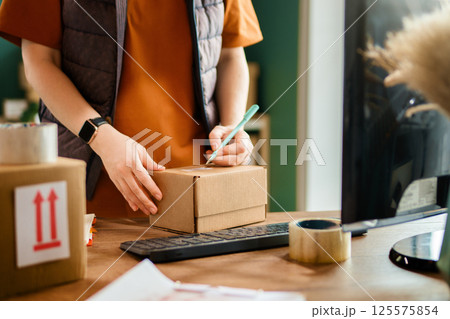 Woman working in a warehouse. Woman working in a warehouse. 125575854