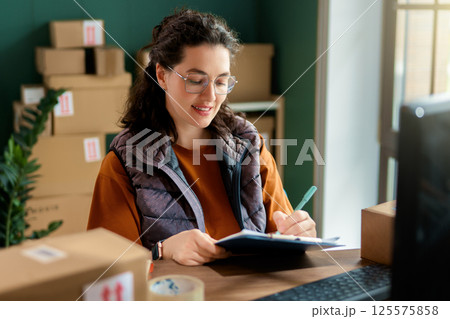 Woman working in a warehouse 125575858