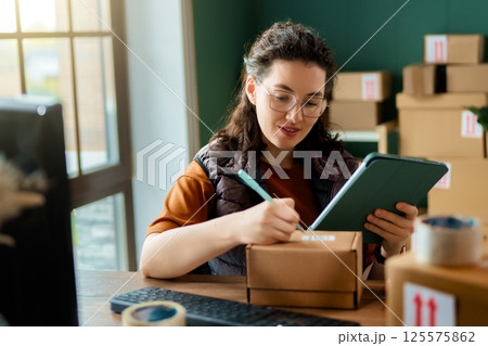 Woman working in a warehouse Woman working in a warehouse 125575862
