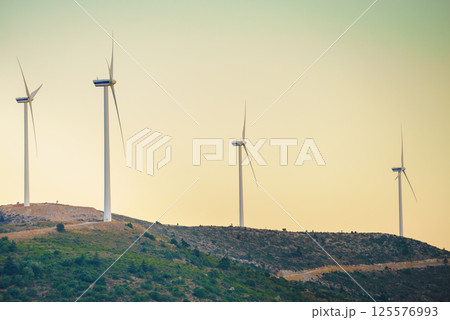 Windmills on Greek hills 125576993