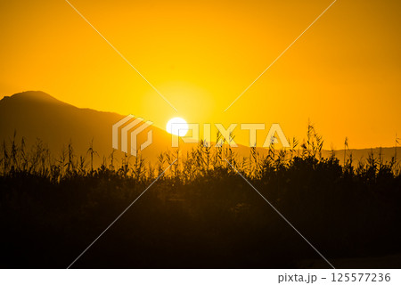 Sunrise over mountain hill 125577236