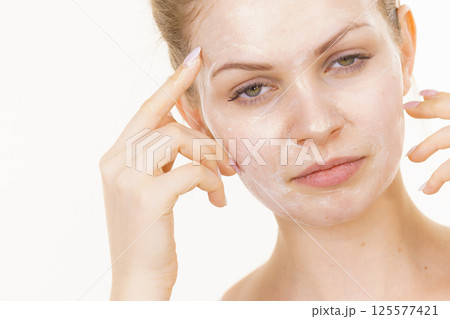 Girl with cream moisture cosmetic on face Girl with cream moisture cosmetic on face 125577421