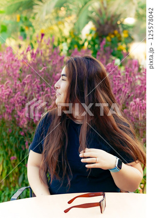 Happy Woman Smiling At Camera In A Field Happy Woman Smiling At Camera In A Field 125578042