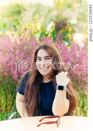 Happy Woman Smiling At Camera In A Field Happy Woman Smiling At Camera In A Field 125578043