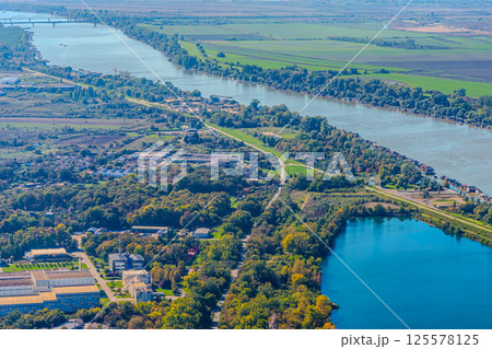 Aerial view of valley with farm fields, pond and Danube river. High quality photo 125578125