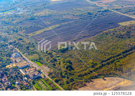 Aerial view of valley with farm fields, pond and Danube river. High quality photo 125578128