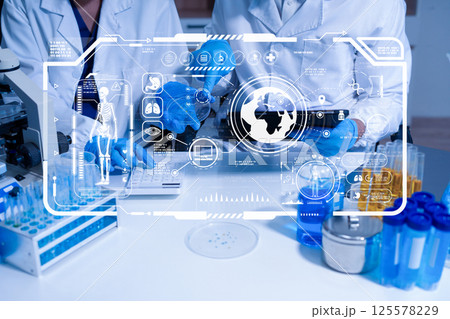 Lab work, Doctor holds a test tube takes the test from a test tube in analysis. Lab work, Doctor holds a test tube takes the test from a test tube in analysis. 125578229